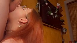 Tattooed redhead girl with glasses sucks dick POV