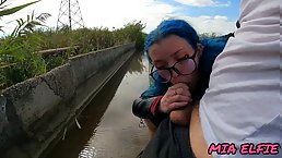 Blue-haired girl with a butt plug loves to have sex and suck dick near the river