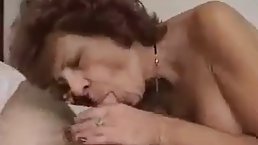 Busty brunette granny in stockings gets fucked POV by young cock