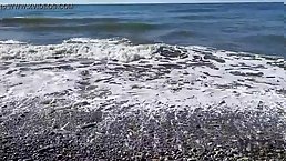 Skinny brunette girl gets fucked with DP by three guys on the beach