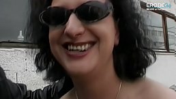 Busty brunette MILF gangbanged outdoor by three guys