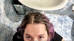 Busty teen with colored hair gets fucked in the bathroom with cum in her mouth