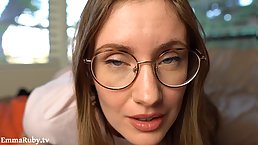 Tattooed brunette girl with glasses Emma Ruby plays with her pussy