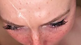 Pretty girl sucks dick and gets cum on her freckled face