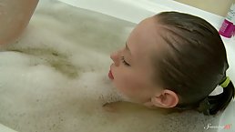 Skinny brunette girl taking bath and shower