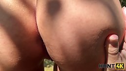 Slender brunette babe in a red swimsuit tricked into wild sex in the park