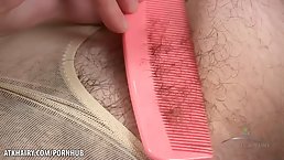 Sexy brunette teen brushes her hairy pussy