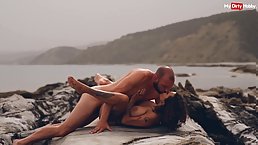 Busty tattooed brunette MILF gets fucked at the beach