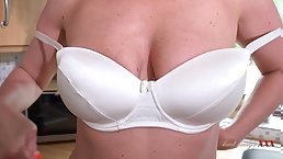 Busty blonde MILF Julia North masturbates in the kitchen