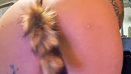 Amateur tattooed redhead MILF Laura Montenegro plays on camera with her tail anal plug