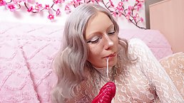 Young blonde in bodystockings plays with huge red dildo