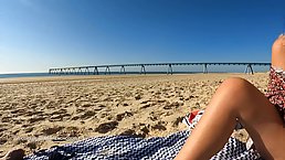 Small tits blonde MILF with sunglasses masturbates with her dildo on the beach