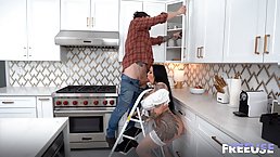 Big tits tattooed brunete MILF in stockings gets fucked by handyman in the kitchen
