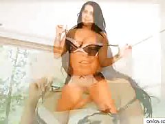Busty, chubby milf licks her glass dildo and inserts it into her wet pussy