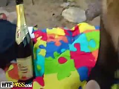 Sex on the beach is much more fun with sluts like this pretty brunette in fishnet outfit