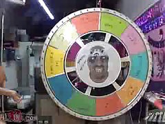 Busty porn star spins the wheel to see just what kind of perverted action she gets to act out for us