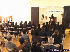 Oriental school girl takes a stand with a strip show, giving everyone a glimpse of her nude figure