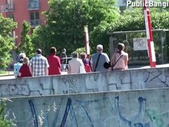 Perverted redhead babe is talked into a nice public dual bang under a busy street