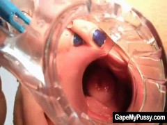 Smut bitch with blonde hair opens up her pussy wide with a specialized sex toy