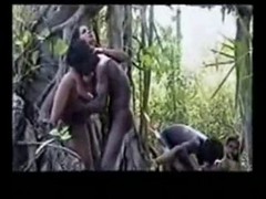 Naked girl is getting gangbanged in the woods by a group of horny black guys