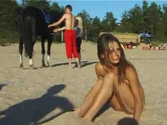 Cute girl was completely naked, on the beach, enjoying while people were looking at her