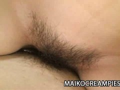 Japanese girl has wet, hairy twat and likes to spread her legs to get nailed