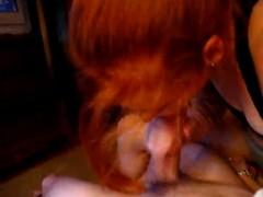 Red haired chick is very dedicated to sucking her boyfrien's dick until he explodes from pleasure