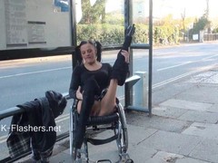 Naughty brunette in a wheelchair is spreading her legs wide open, to show her pussy
