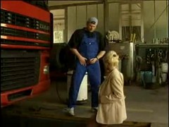 Alexandra Ross and a guy who repaired her car are having sex in a huge garage