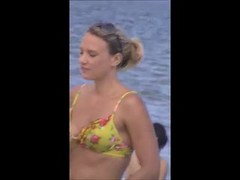 Lovely lady was on the beach not knowing that someone was making a video of her tits