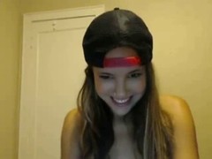 Sweet teen is passionately drilling her wet pussy while her boyfriend is watching her on web cam