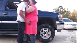 Fat woman in pink dress was fucking a horny guy until they both got satisfied