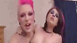 Slutty woman with pink hair and her best friend are taking turns sucking one huge dick