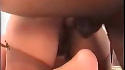 Mature blonde woman is having steamy sex with a black guy, in front of her husband