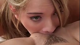 Two girls are licking each others pussy on the couch, while no one else is at home