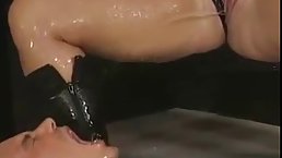 Kinky ladies and one guy are wearing latex costumes and peeing all over each other