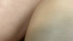 Sexy mature is sitting on the couch and rubbing her shaved pussy like a crazy whore