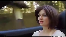 Naughty brunette girl is sucking her boyfriend’s thick cock in his car, in the woods