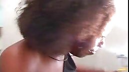 Black babe with curly hair is gently sucking her partner's dick and riding it like a slut