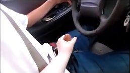 Naughty woman is gently rubbing her step- son's dick while he is trying to drive them home