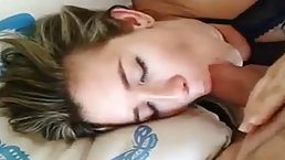 Horny girl is lying on the bed and rubbing her wet pussy, while her man is watching