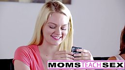 Mature blonde woman is giving free blowjob lessons to two girls at the same time