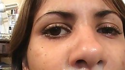 After a nice blowjob, a sexy girl is getting sticky cum all over her face