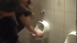 German woman is getting banged in the public toilet after she is done with sucking hard dick