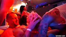 Super sexy girls are having a lot of fun in the night club, with random guys