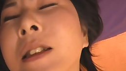 Mature Asian brunette is sucking her lover's dick while her husband is not at home