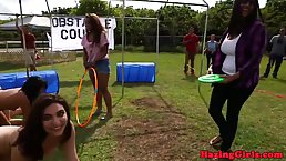 Kinky college girls are having a threesome in front of their friends and enjoying a lot