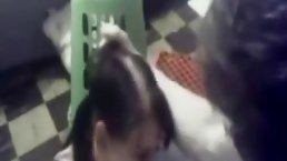 Nerdy brunette with glasses is sucking dick while her partner is gently pushing her head down