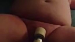 Fat woman is using a vibrator because she desperately needs a very intense orgasm, right away