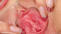 Busty babe is spreading her pink pussy in front of her web camera, before masturbating